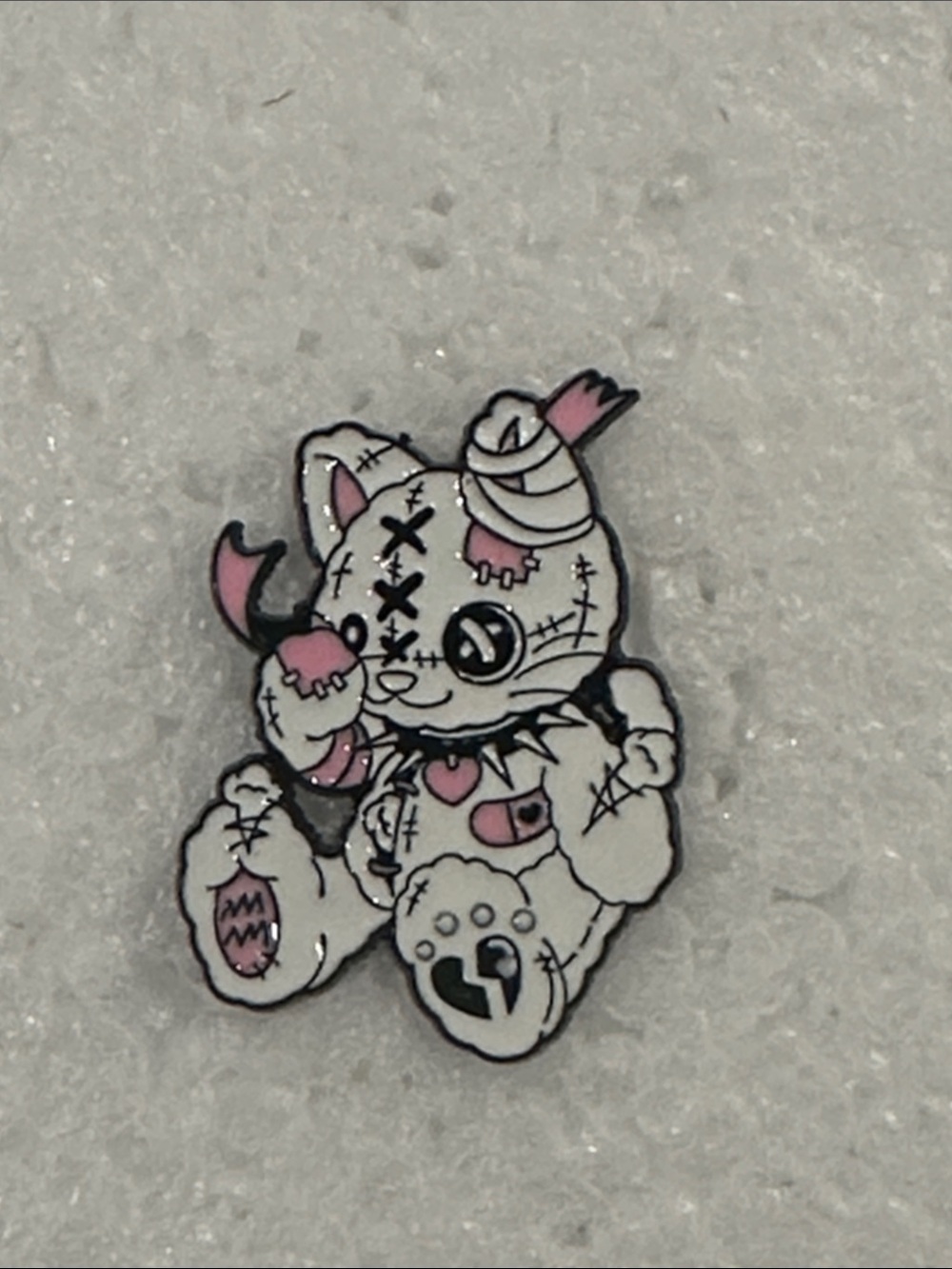 Pink and White Damaged Plush-Style Enamel Cat Horror Pin